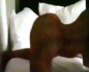 Nicki Minaj twerking on a bed in a transparent dress from nitya minan nude