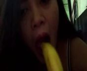 indo MILF bitch sucking a banana as if it were a dick from indo milf