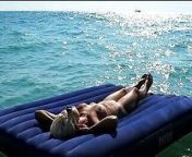 I watched on the beach how a naked girl with big tits was sunbathing on a mattress. Slow motion from nudist mo