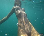 Nude model swims on a public beach in Russia. from princess models nudeuslim mazhabi sex