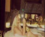 Christina Aguilera in bathtup wearing a cowboy hat from christina aguleri doggy
