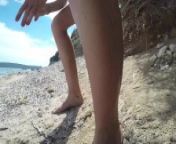 girl pissing on public beach from nudist 956x1440
